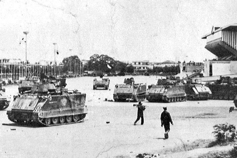 Armored vehicles and soldiers in stadium