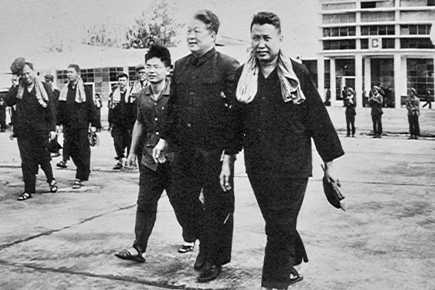 Pol Pot walks with two men