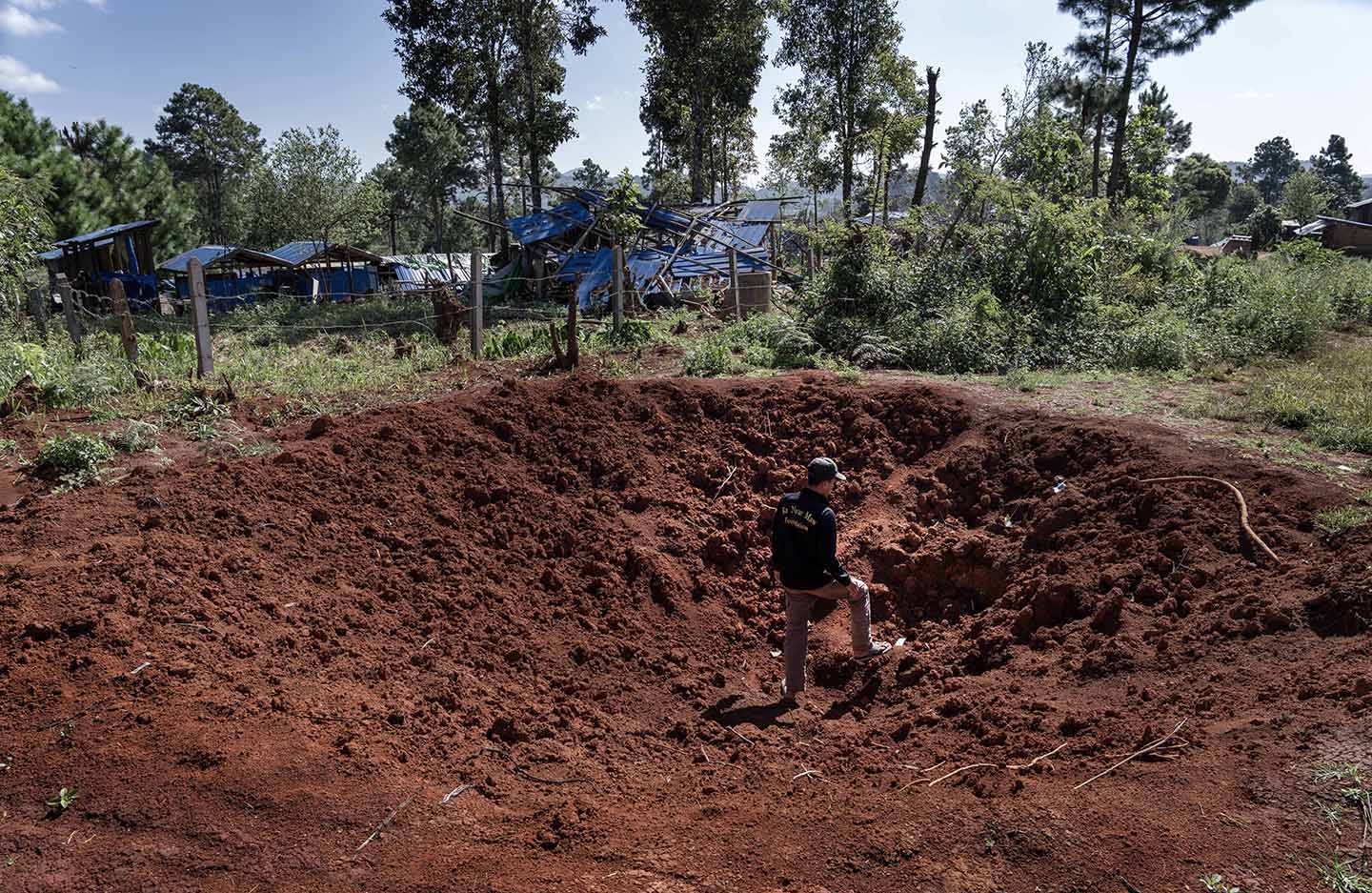 Man stands in a large crater