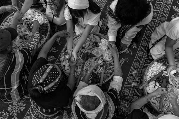 Members of the Karen community gather at the annual wrist tying ceremony in Frankfort, New York, Aug. 17, 2024. As part of the ceremony, monks and elders tie strings around participants’ wrists to keep them safe.  