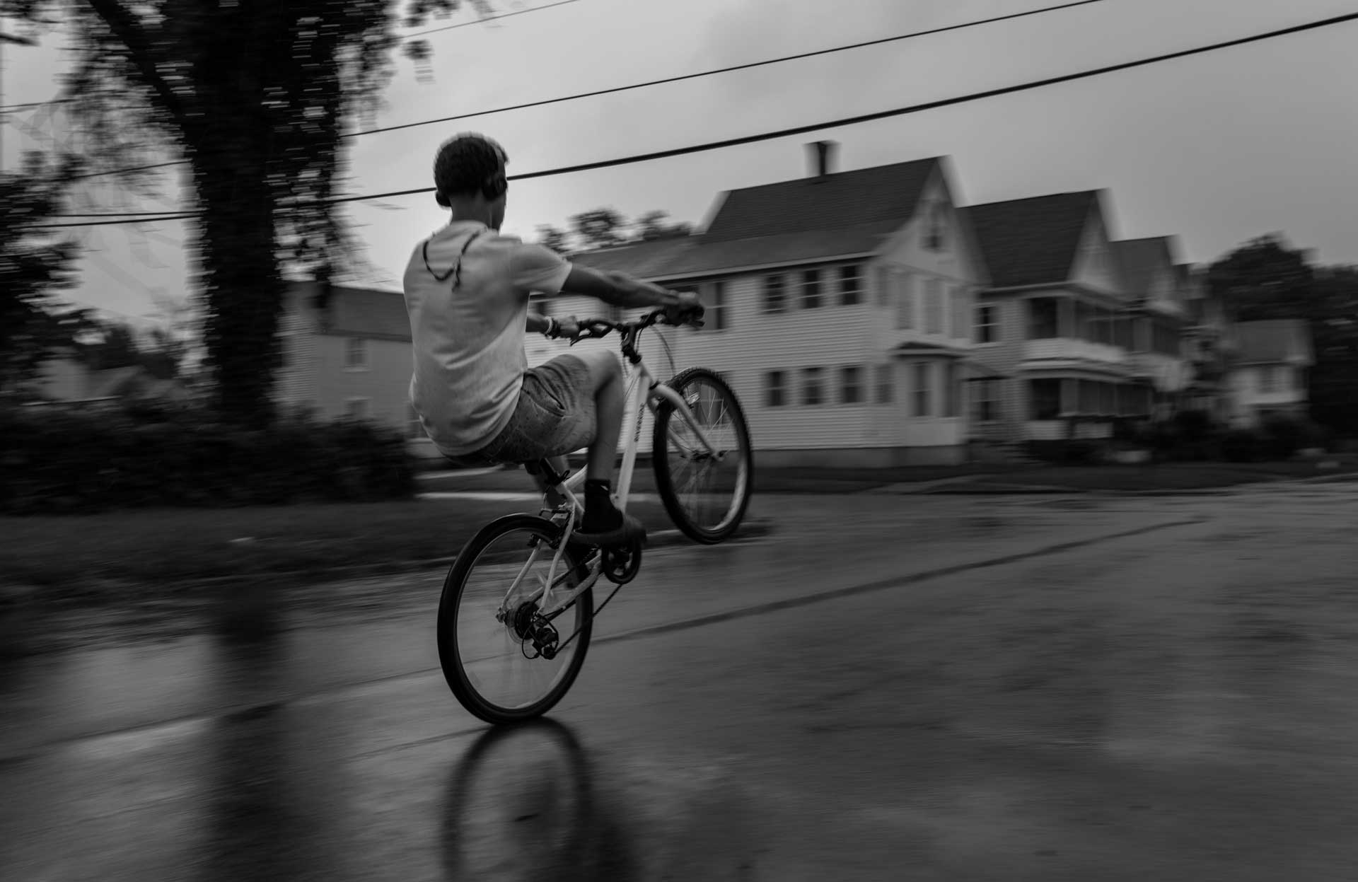 Christopher Arrendel, a friend of Nyah Mway, pops a wheelie in Utica, New York, Aug. 18, 2024. 'Nyah was a funny guy,' said Christopher, who is also a neighbor. He saw a video of the shooting incident on social media but had no idea the victim was his friend until later.