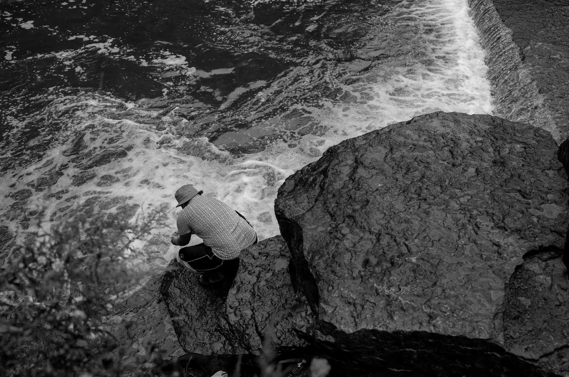 Thoung Oo, Nyah Mway’s eldest brother visits a stream in Utica, New York, Aug. 19, 2024. The brothers used to go on bicycle rides, play basketball in a nearby court and take a dip in the stream, especially during hot summer days. 