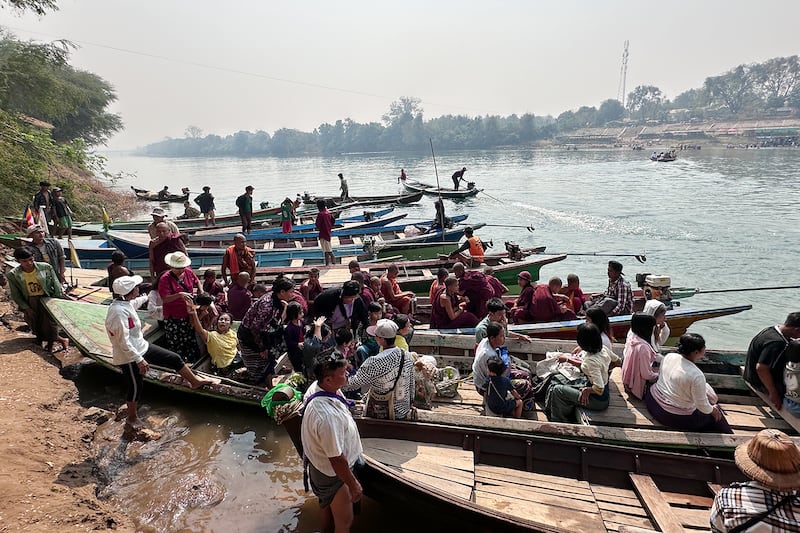 People arrive in boats for the annual Shwe Saryan Pagoda harvest festival in Shwe Saryan village, Patheingyi township, Mandalay region, Myanmar, March 11, 2025.