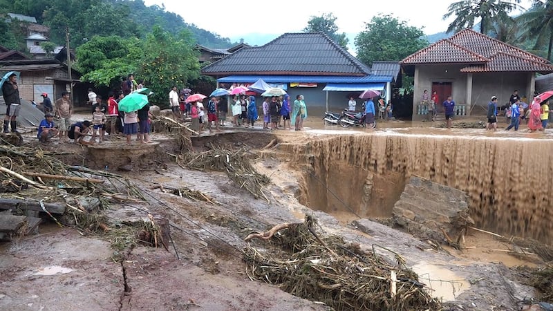 Residents of Oudomxay province avoid a large sinkhole caused by heavy rains. Credit: Radio and Television of Oudomxay province