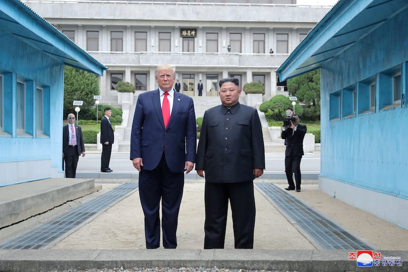 U.S. President Donald Trump and North Korean leader Kim Jong Un pose at a military demarcation line at the demilitarized zone separating the two Koreas, in Panmunjom, South Korea, June 30, 2019.