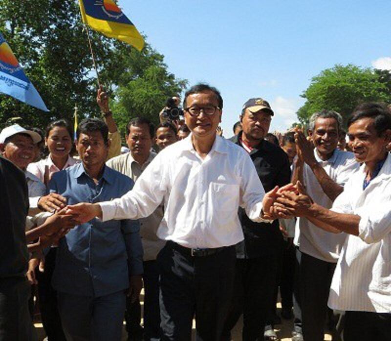 CNRP President Sam Rainsy meets with supporters in Prey Veng province, Aug. 5, 2013. Photo credit: RFA.