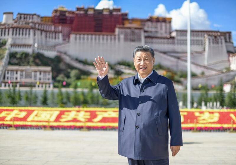 Chinese President Xi Jinping waves while visiting a public square below Potala Palace in Lhasa in western China's Tibet Autonomous Region, July 22, 2021. (Xie Huanchi/Xinhua via AP)