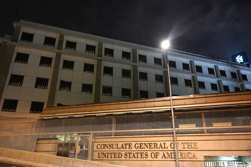 Candles are seen lit in the windows of the United States Consulate on the occasion of the 32nd anniversary of Beijing's deadly Tiananmen Square crackdown in 1989, in Hong Kong, June 4, 2021. Credit: AP