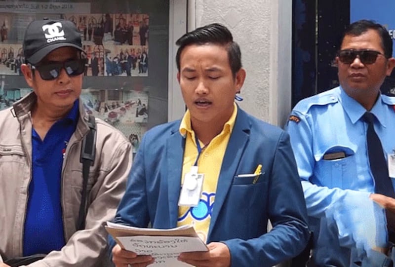 Lao democracy advocate Od Sayavong reads a statement at a protest in Bangkok, Thailand, June 16, 2019.