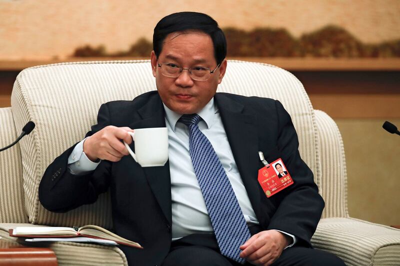 Shanghai party chief Li Qiang drinks during a group discussion held on the sidelines of the National People's Congress at the Great Hall of the People in Beijing, Tuesday, March 6, 2018. Credit: AP