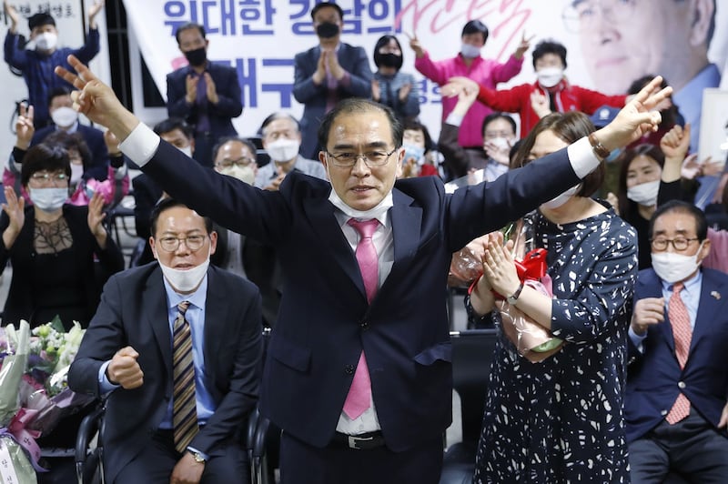 Thae Yong Ho, center, former North Korean diplomat, who defected to South Korea in 2016 and a candidate of the main opposition United Future Party, reacts after he was certain to secure victory in the parliamentary election in Seoul, South Korea, Thursday, April 16, 2020.