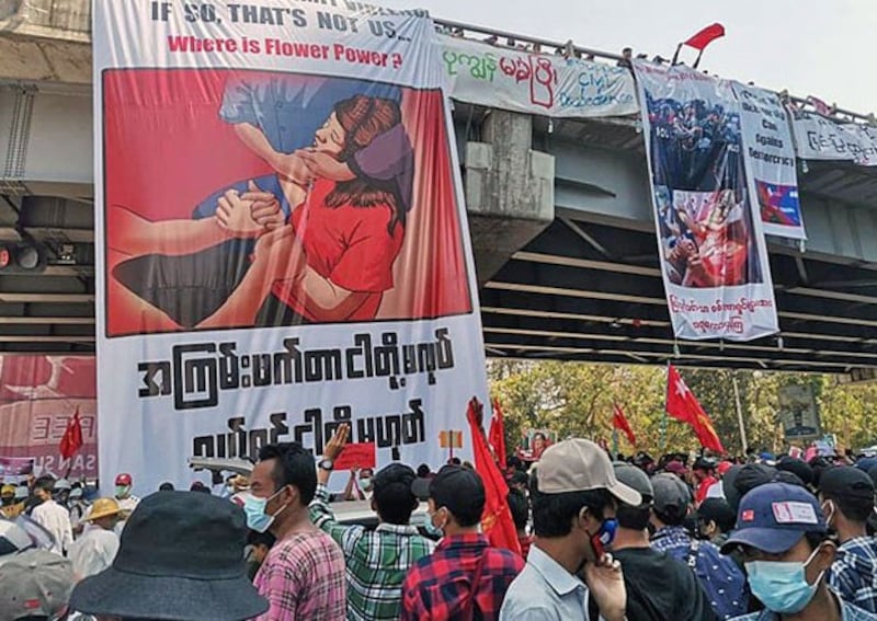 myanmar-protesters-banners-overpass-yangon-feb10-2021.jpg