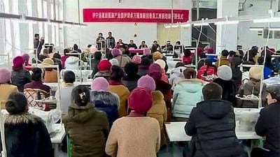 Officials meet with workers at the Zhuowan factory in Ghulja county, in the XUAR's Ili Kazakh Autonomous Prefecture, in an undated photo. RFA listener