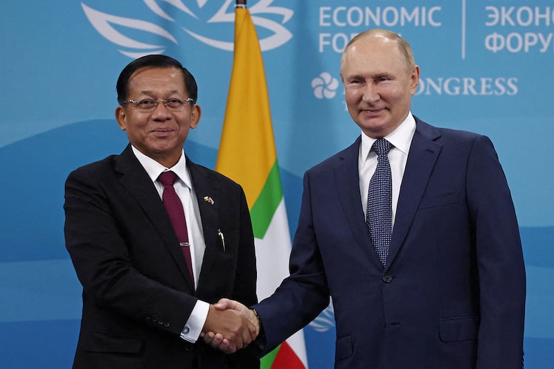 Russian President Vladimir Putin, right, shakes hands with Myanmar's Prime Minister Min Aung Hlaing during a meeting 
 at the 2022 Eastern Economic Forum in Vladivostok, Russia,  Sept. 7, 2022.