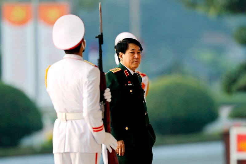 Gen. Luong Cuong, right, now in charge of the CPV Secretariat, which runs the party's day-to-day operations, attends the closing ceremony of the 13th National Congress of the Communist Party of Vietnam at National Convention Center in Hanoi, Feb. 1, 2021. (Minh Hoang/AP)