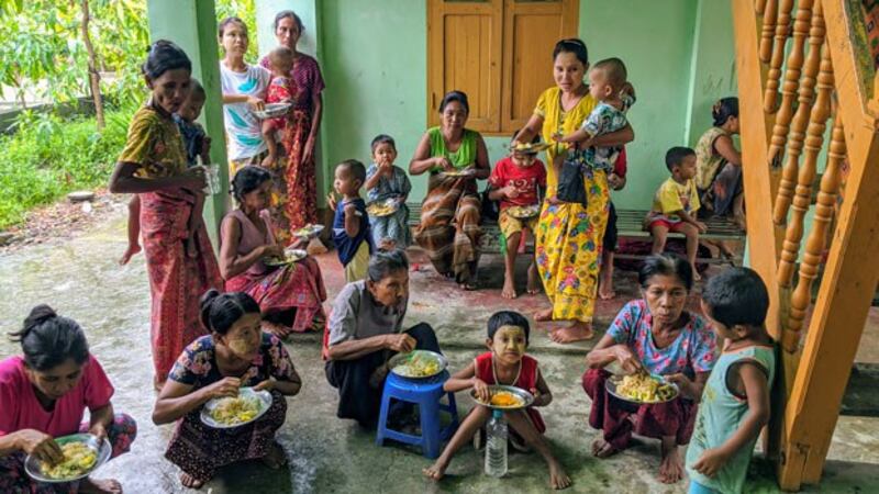 Myanmar woman and children who fled armed conflict in Rathedaung township, northern Rakhine state, find temporary shelter in Rakhine's capital Sittwwe, July 1, 2020.