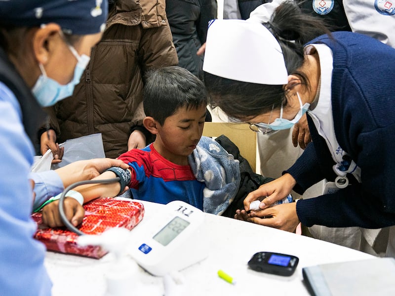 Medical workers attend to an injured child, in the aftermath of an earthquake, at the Xigaze People's Hospital in Xigaze City, southwest China's Tibet Autonomous Region, Jan. 8, 2025.