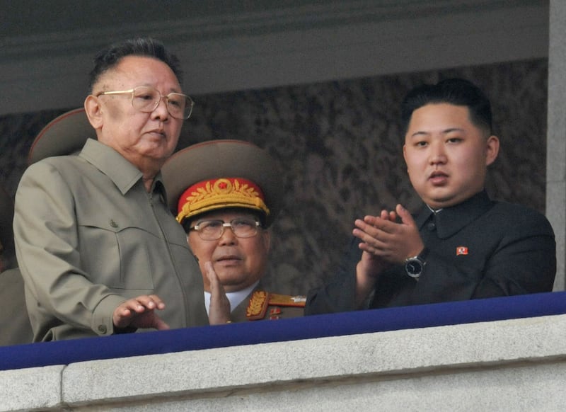 North Korea's National Defense Commission Chairman Kim Jong-il, left, and his son Kim Jong-un, right, watch  a parade commemorating the 65th anniversary of the founding of the Workers' Party of Korea in Pyongyang, Oct.10, 2010.