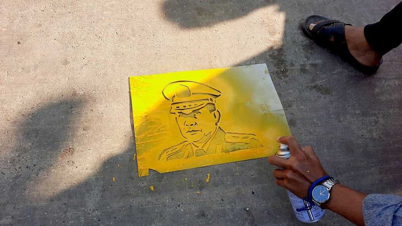 Coup leader Gen. Min Aung Hlaing's image is spray-painted onto a street in Pathein in the Ayeyarwady Region. (RFA)