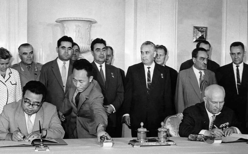 Soviet Prime Minister Nikita Khrushchev [right] and North Korean leader Kim Il Sung sign the Soviet-DPRK Treaty of Friendship, Co-operation, and Mutual Assistance on July 6, 1961, in Moscow. Credit AFP/TASS.