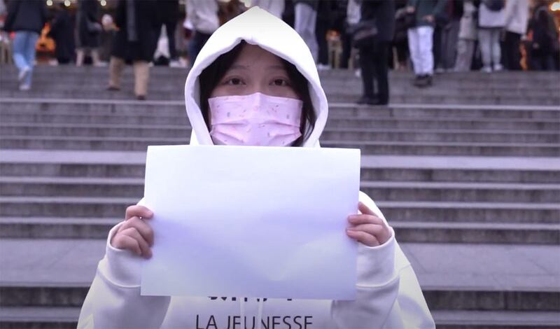 Apple, a member of the dissident group China Deviants, organized a rally in London this week to mark the one-year anniversary of the White Paper resistance. Credit: Shi Shi