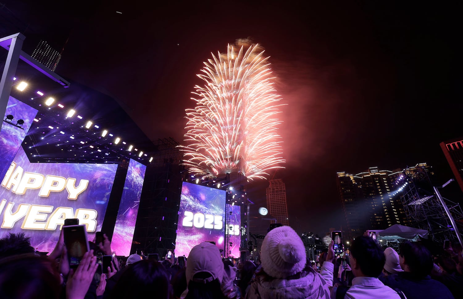 Fireworks blast out from the Taipei 101 skyscraper in Taipei on Jan. 1, 2025.