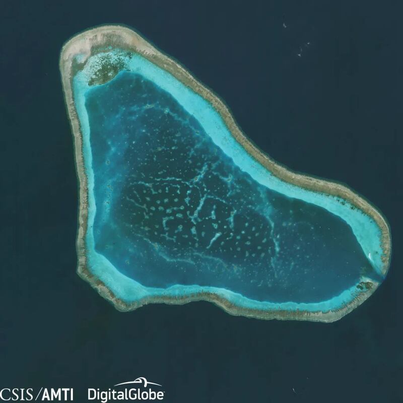 Scarborough Shoal (also known as Bajo de Masinloc, Panatag Shoal and Huangyan Dao) is seen in a satellite photo, Nov. 18, 2015. (CSIS/AMTI – Digital Globe)