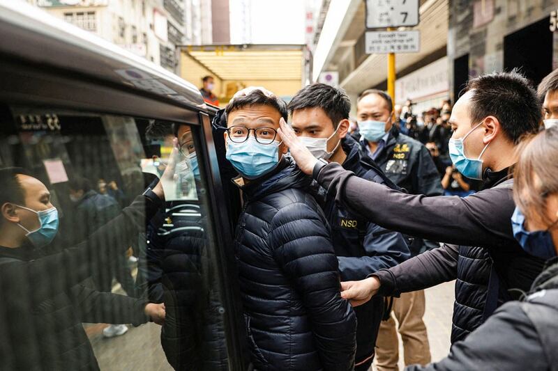 Stand News acting chief editor Patrick Lam is arrested at his office. (Reuters)