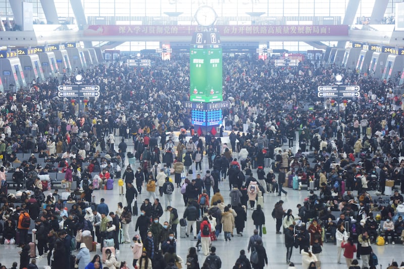 People crowd a railway station in Hangzhou, in China's eastern Zhejiang province, Jan. 22, 2025, as millions of people across China head to their hometowns ahead of Lunar New Year celebrations.