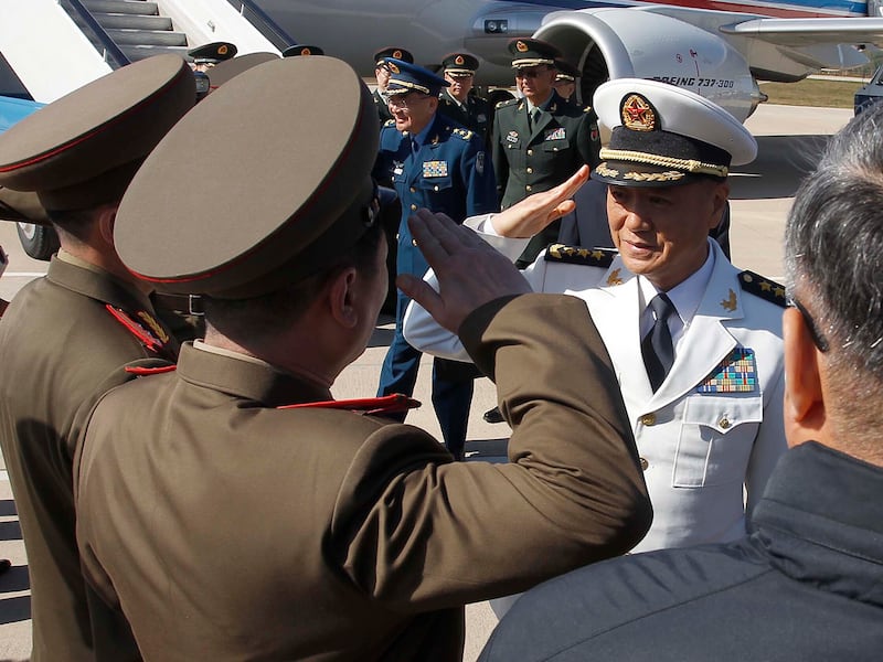 Miao Hua, right, China's director of the political affairs department of the Central Military Commission arrives at the Pyongyang Airport in Pyongyang, North Korea Monday, Oct. 14, 2019.