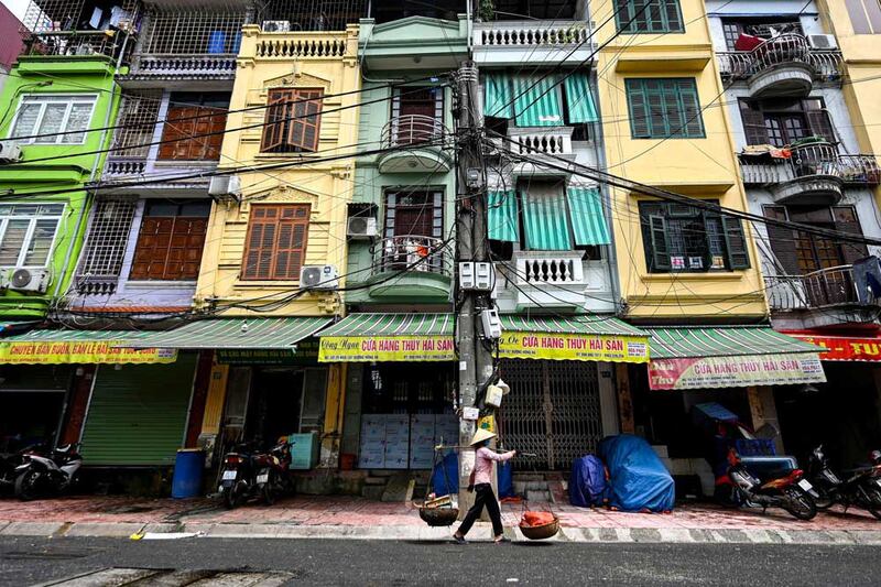 Many tube houses have a business in the front of the first floor while the family occupies the space behind and above it. (AFP)