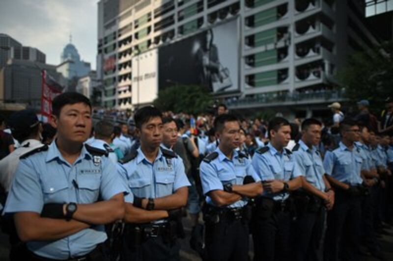 Police form a line in the Admiralty district of Hong Kong, Oct. 13, 2014. (Credit: AFP)