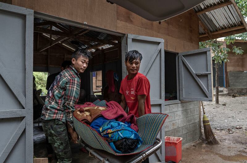 Ambulance staff and relatives carry a deceased person out of O-1 hospital in Demoso, Kayah state, Myanmar, Nov. 6, 2024.