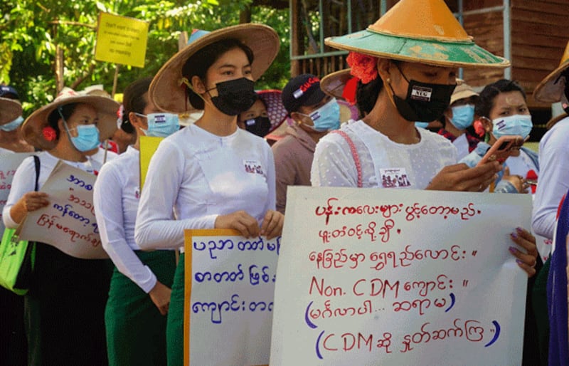 Teachers in uniform take part in a Civil Disobedience Movement demonstration against the military regime that overthrew the elected national government, in Dooplaya district, eastern Myanmar's Kayin state, May 13, 2021. Credit: AFP/KNU Dooplaya District