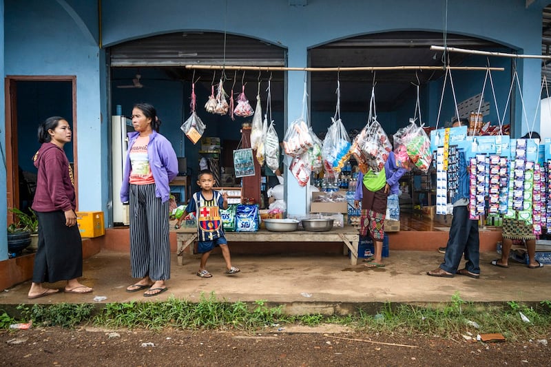 Local villagers are seen at a general store in Nakasong village by the Mekong River, Aug. 26, 2022 in Si Phan Don, Laos. (Sirachai Arunrugstichai/Getty Images)