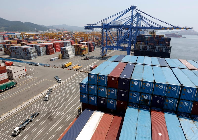 A file photo showing trucks used to transport containers at the Hanjin Shipping container terminal at the Busan New Port in Busan, about 420 km (261 miles) southeast of Seoul, Aug. 8, 2013. Credit: Reuters.