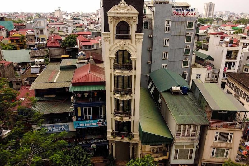 A tube house with a particularly ornate facade rises six stories. (AFP)