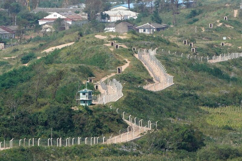 Guard posts and fences ring a hill side on the North Korea border with Russia and China seen from China's Yiyanwang Three Kingdoms viewing platform in Fangchuan in northeastern China's Jilin province Tuesday, Sept. 12, 2023. Credit: Ng Han Guan/AP