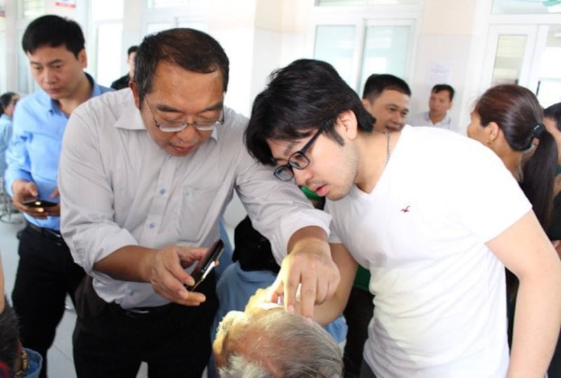 Japanese ophthalmologist Tadashi Hattori treats a patient in Vietnam, in this undated handout photo provided by the Ramon Magsaysay Award Foundation, Aug. 31, 2022. Credit: Handout