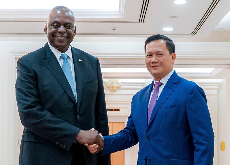 U.S. Defense Secretary Lloyd Austin, left, shakes hands with Cambodia Prime Minister Hun Manet in Phnom Penh, June 4, 2024. (AKP via AP)