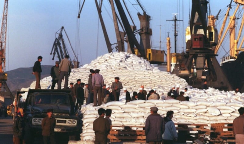 Unloading wheat at the Hungnam Port in North Korea. The photo is not directly related to the article  (AFP Photo)