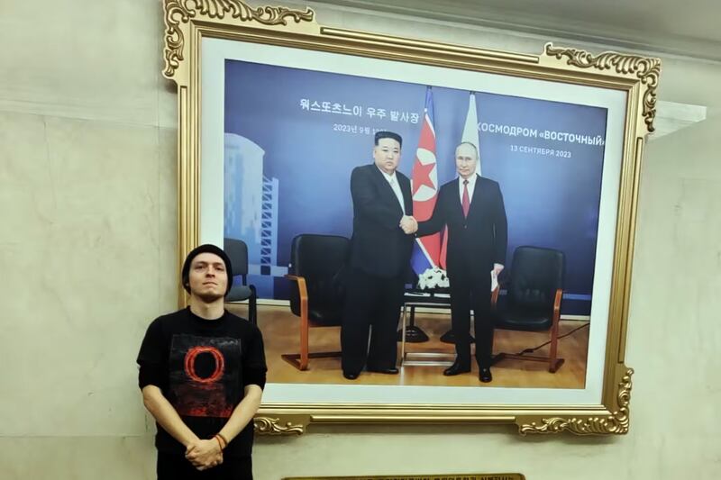 Pierre-Emile Biot stands beside a photo, Feb. 20, 2025,  from the Summit between North Korean State Affairs Commission Chairman Kim Jong-un and Russian President Vladimir Putin, at the Choro-Russia Friendship Pavilion in Rason, North Korea.