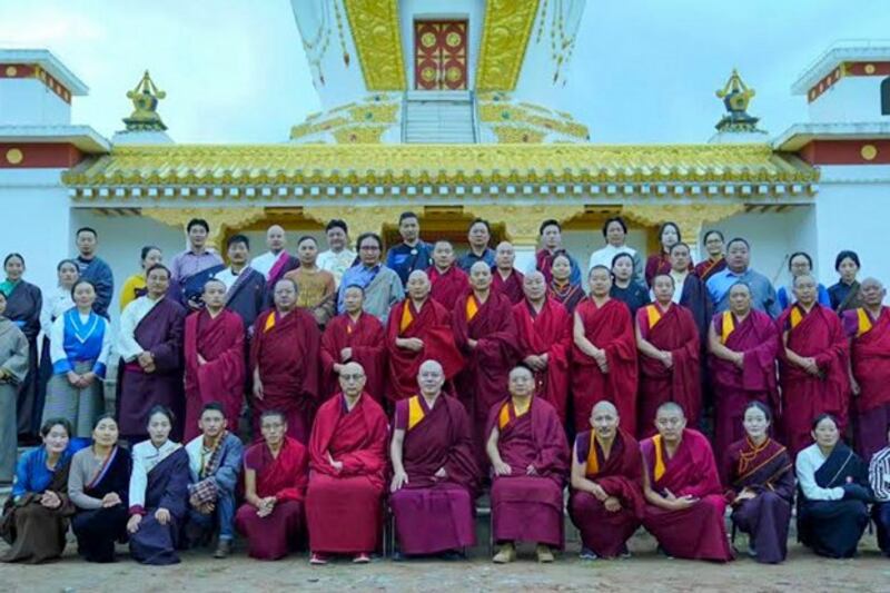 School teachers and staff pose for a group photo outside the Gangjong Sherig Norling school in a Tibetan area of western China's Qinghai province. (Central Tibetan Administration)