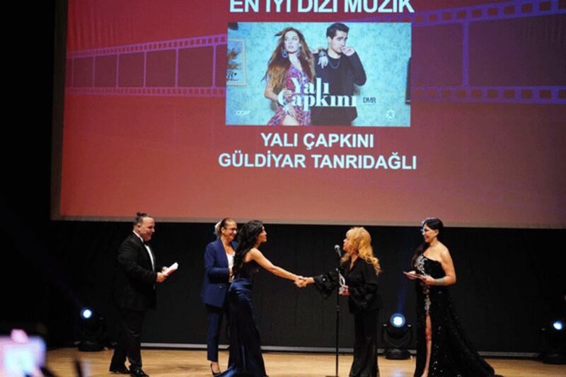 Güldiyar Tanridagli (3rd from L) receives the 'Best TV Series Music' award from Turkey's Film-San Foundation at a ceremony at Cemal Resit Rey Concert Hall in Istanbul, Sept. 9, 2024. (Provided by Güldiyar Tanridagli )