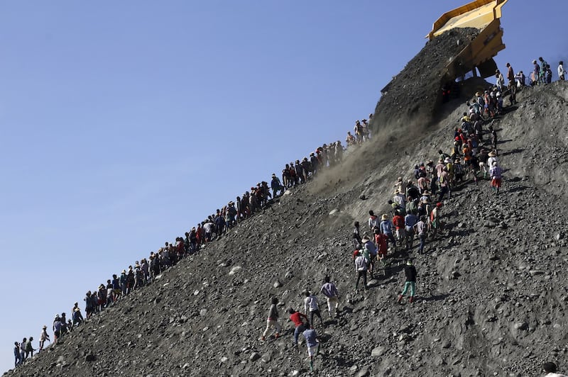 Miners search for jade stones at a mine dump at a Hpakant jade mine in Kachin state, Myanmar, Nov. 25, 2015. Credit: Reuters