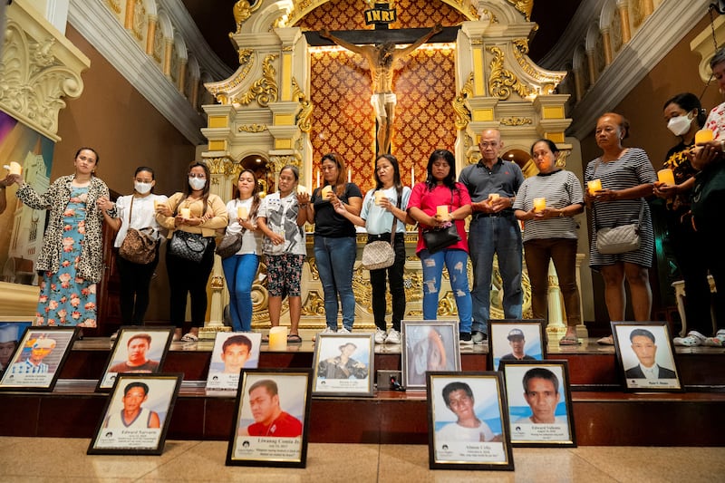 Relatives of victims of drug war and extrajudicial killings gather during a mass, following the arrest of former Philippine President Rodrigo Duterte, in Quezon City, Philippines, March 11, 2025. REUTERS/Lisa Marie David