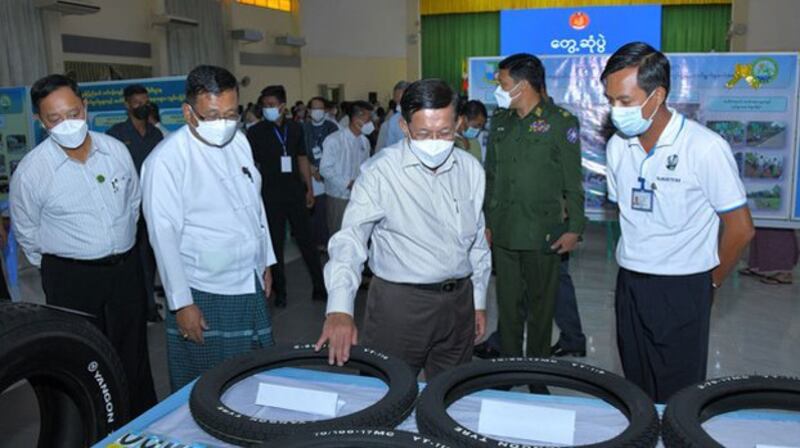 Myanmar junta chief Senior Gen. Min Aung Hlaing inspects local products after meeting with representatives of small manufacturing businesses in Mawlamyine, southeastern Myanmar's Mon state, Oct. 18, 2022. Credit: Myanmar military