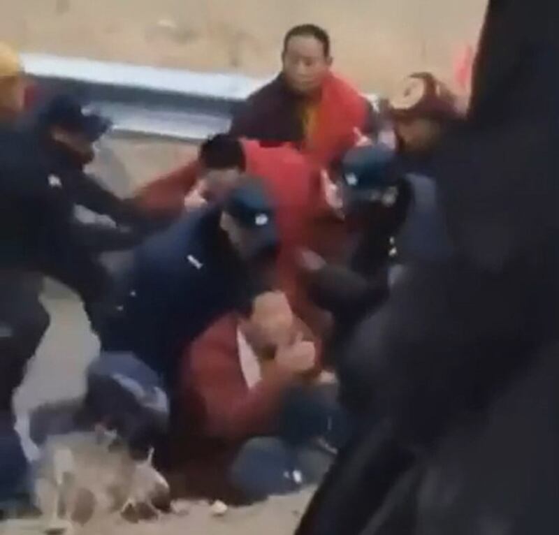 Chinese authorities arrest Tibetan monks during a protest against a dam project on the Drichu River in Dege county, southwestern China's Sichuan province, Feb. 22, 2024. (Image from citizen journalist video)