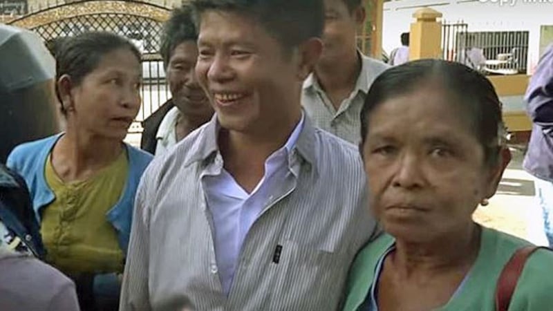 A Kyaung Taung villager (C) smiles after he is released by a court in Mrauk-U township, western Myanmar's Rakhine state, Jan. 8, 2019.