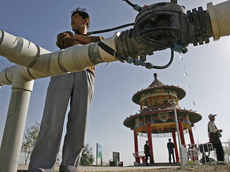 Water drips from a leaking pipe on a hilltop overlooking Korla, Oct. 10, 2006, an oil town on the edge of the Tarim Basin and the Taklamakan Desert, Xinjiang, China.